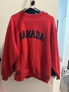 Mondetta Red Crewneck Sweatshirt with Black 'CANADA' Lettering